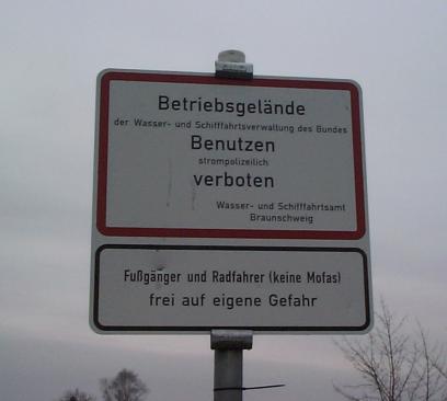 a sign warning about travelling along the canal