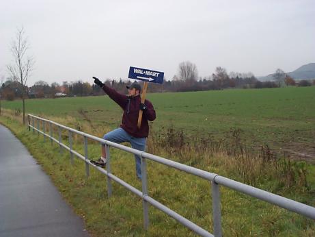 josh holding a walmart sign